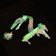 Load image into Gallery viewer, Lochness Monster Limited Edition Pin Sets - Soft Enamel with Epoxy - Collect Before They Disappear - 3-inch Size - Backstamp and Laser Numbering - Includes Matching Vinyl Sticker - Various Designs and Metal Plating - Full Glow, Glitter, and Specialty Options - Order Now